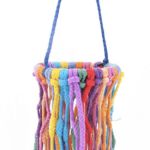 A Aglet Heaven SM hanging basket with colorful fringes hanging from it.